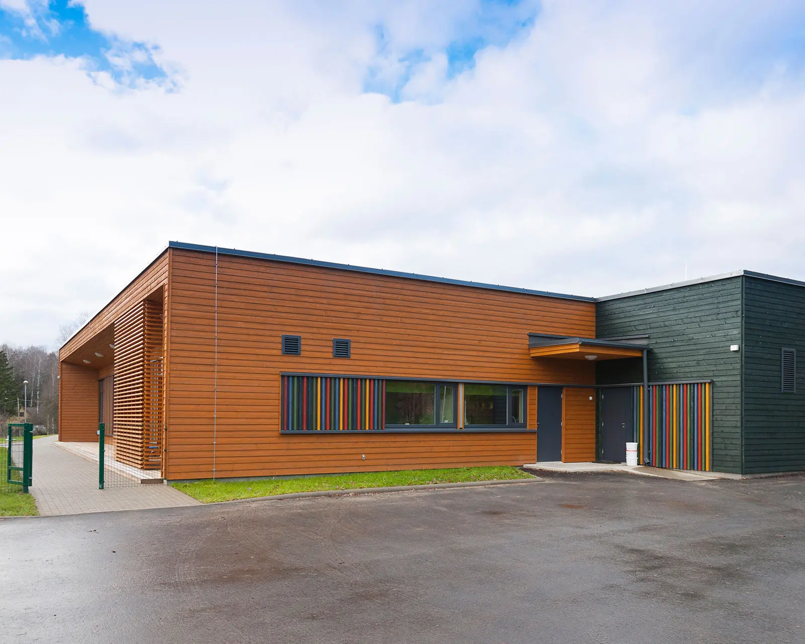 Wooden exterior with vibrant window trims