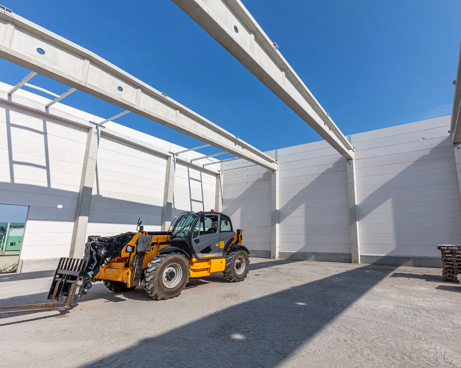 Forklift inside unfinished building structure