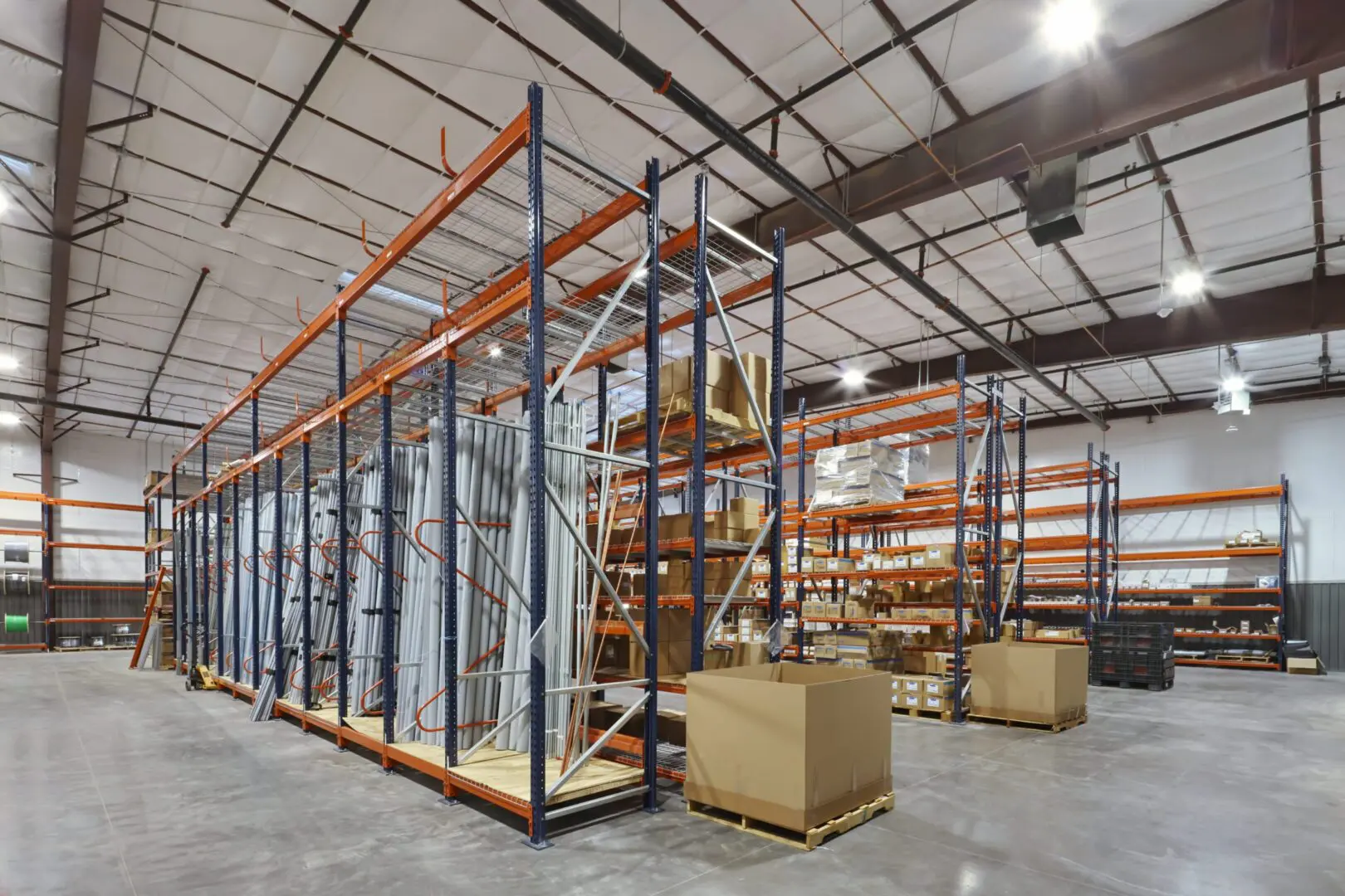 Warehouse interior with shelving and storage boxes.