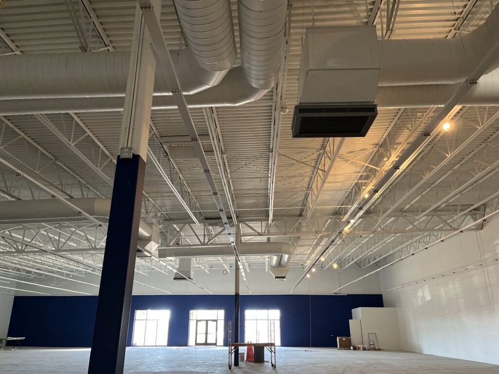 Spacious interior of a commercial building under construction.